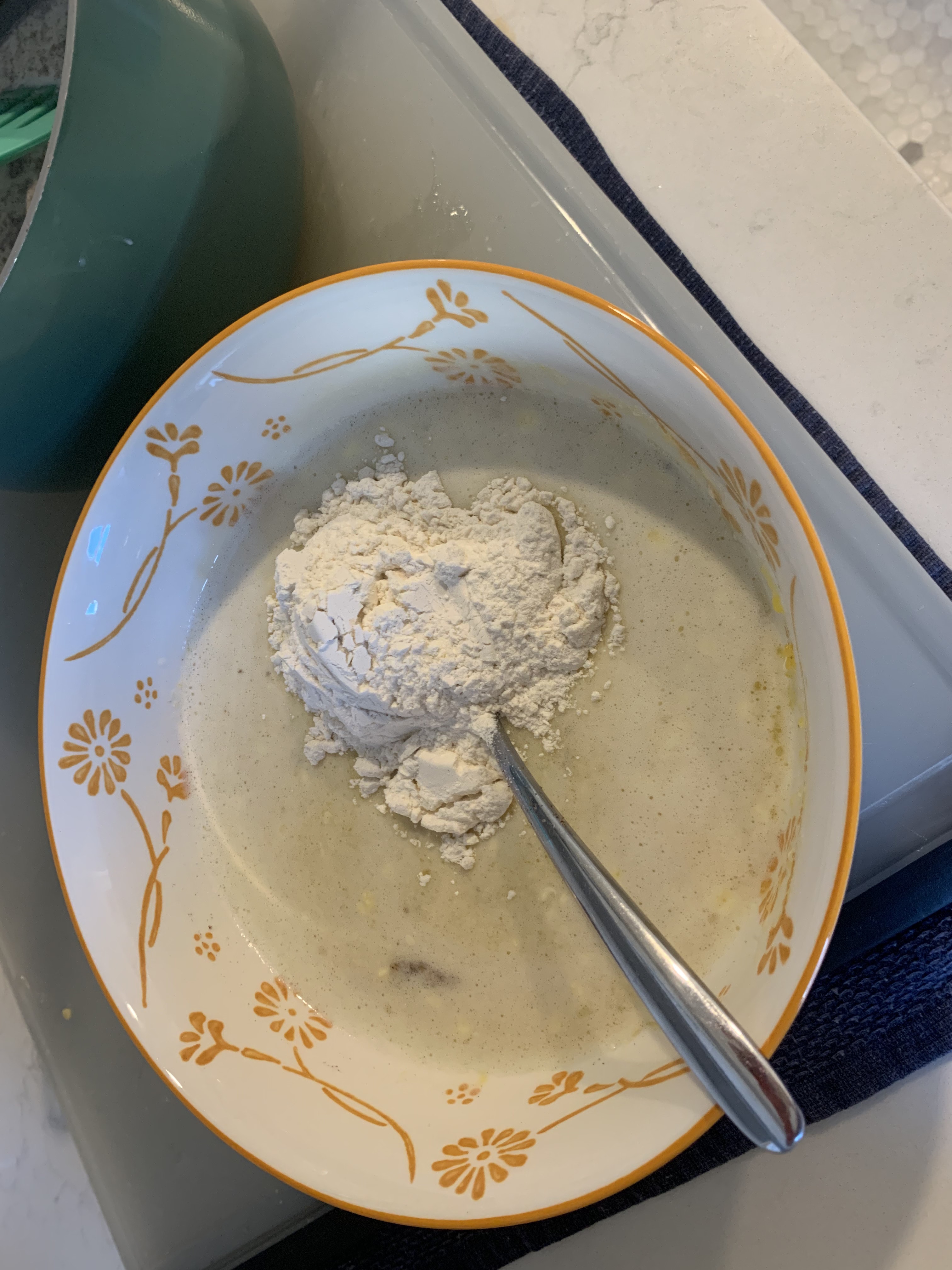 Adding flour to the batter