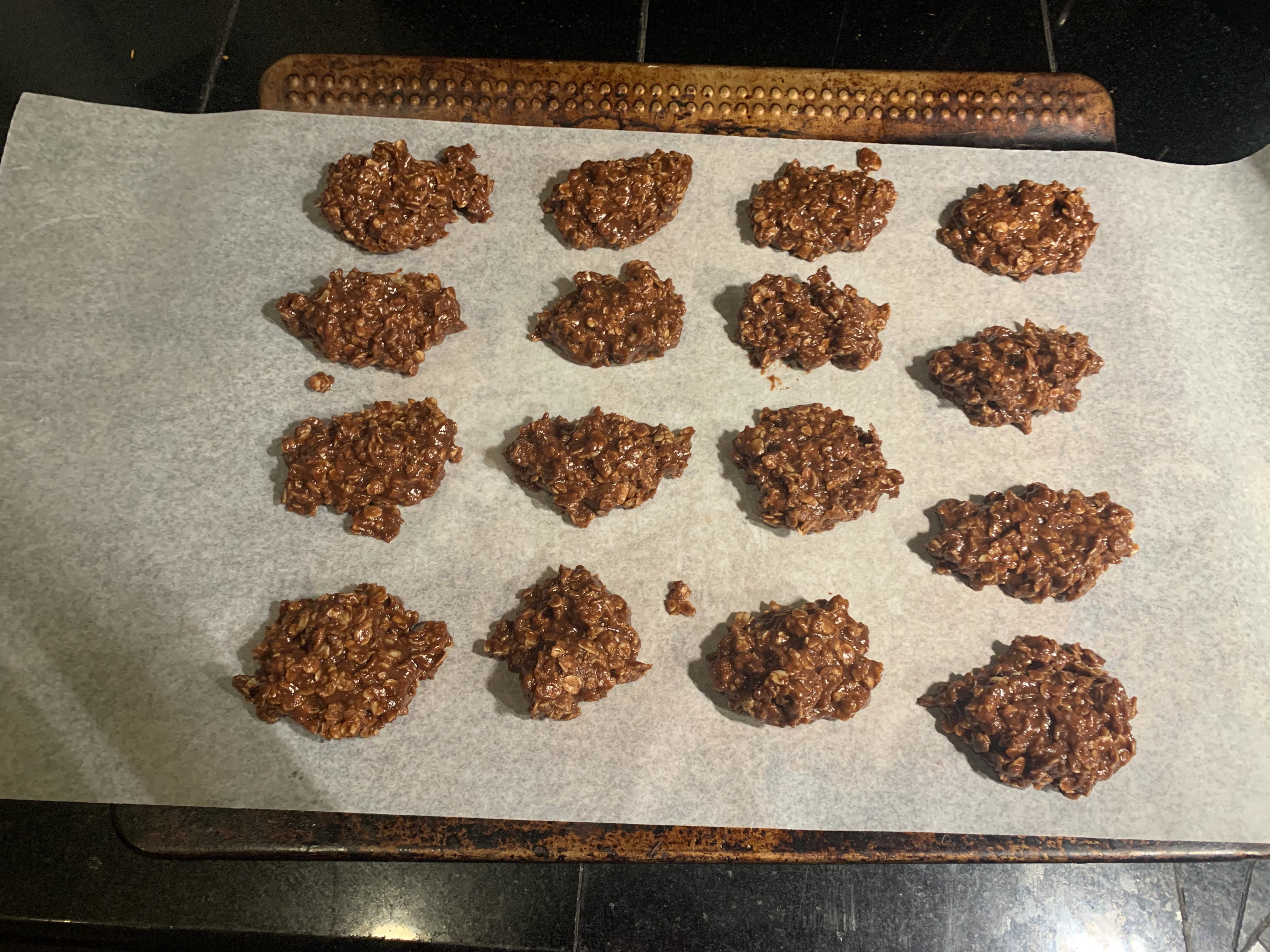 Cookies spooned onto parchment paper