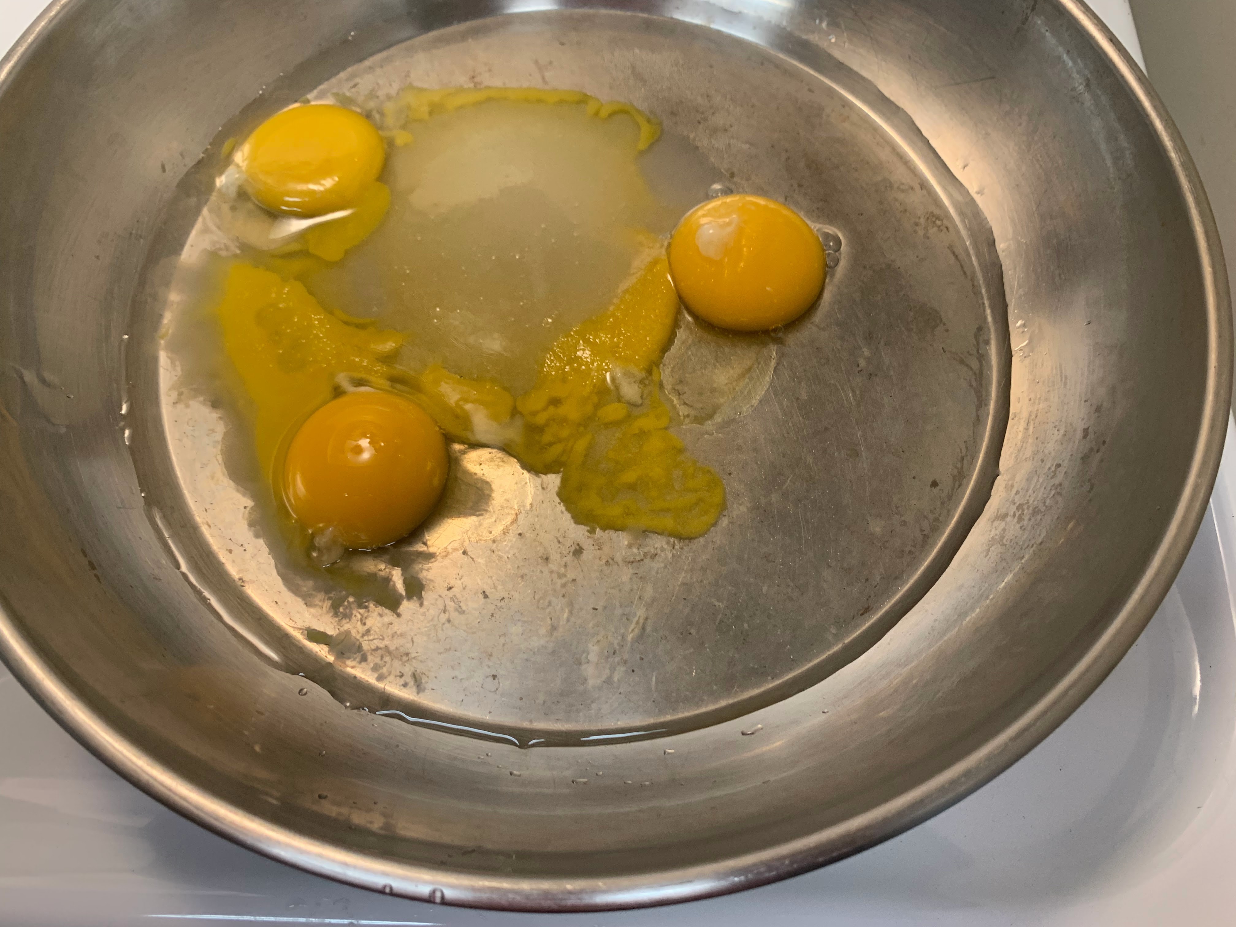 Egg yolks, sugar and water in saucepan before cooking