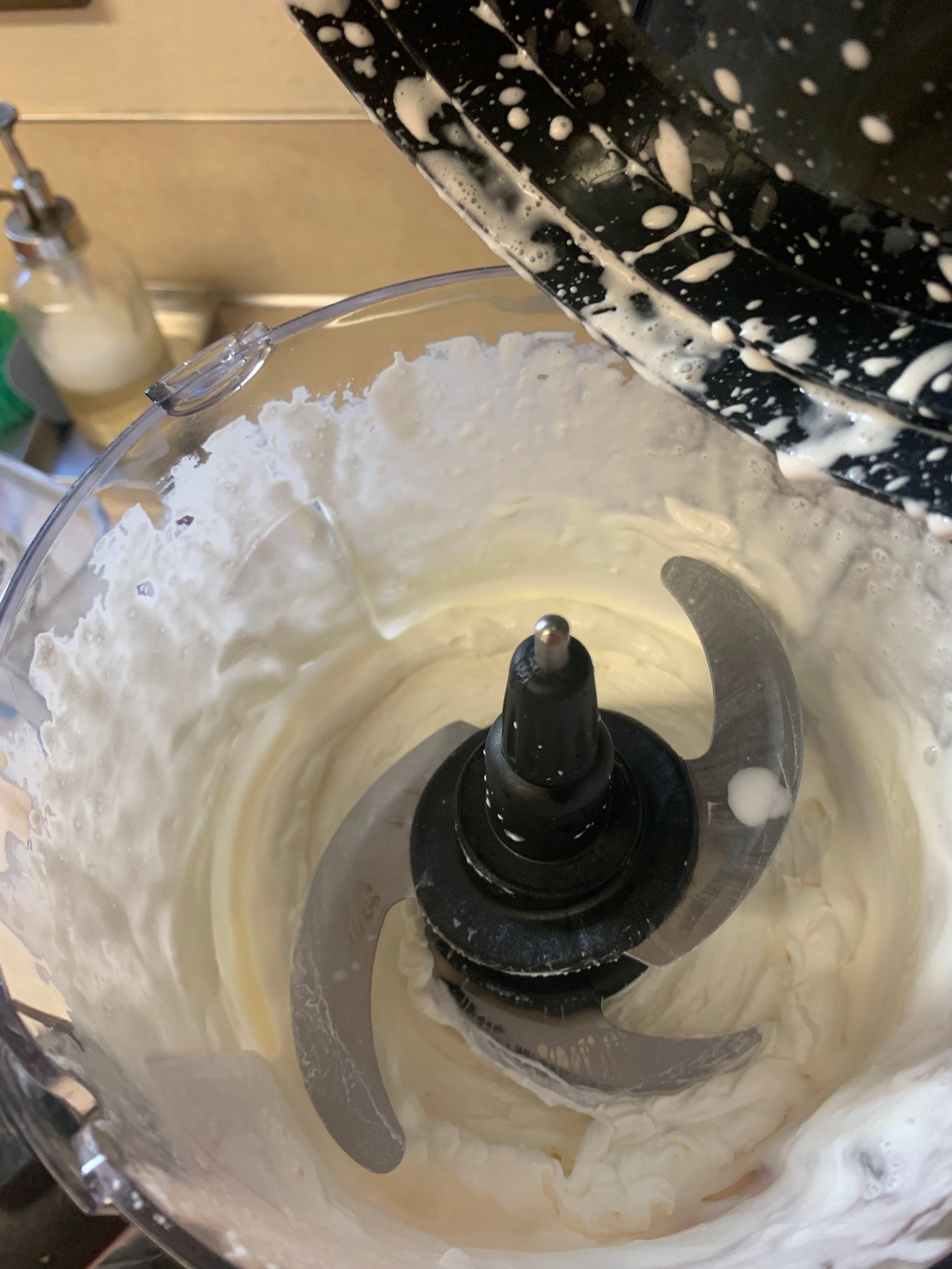 Whipped cream at soft peaks in food processor